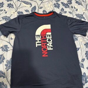 The North Face T shirt. Boys navy with red and white writing